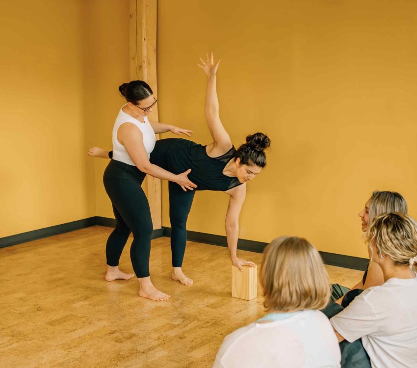 YTT_YogaTeacherTraining_AmitieYoga5 Amitié Yoga - Yoga Teacher Training YTT Yoga Alliance - Teacher correcting student posture
